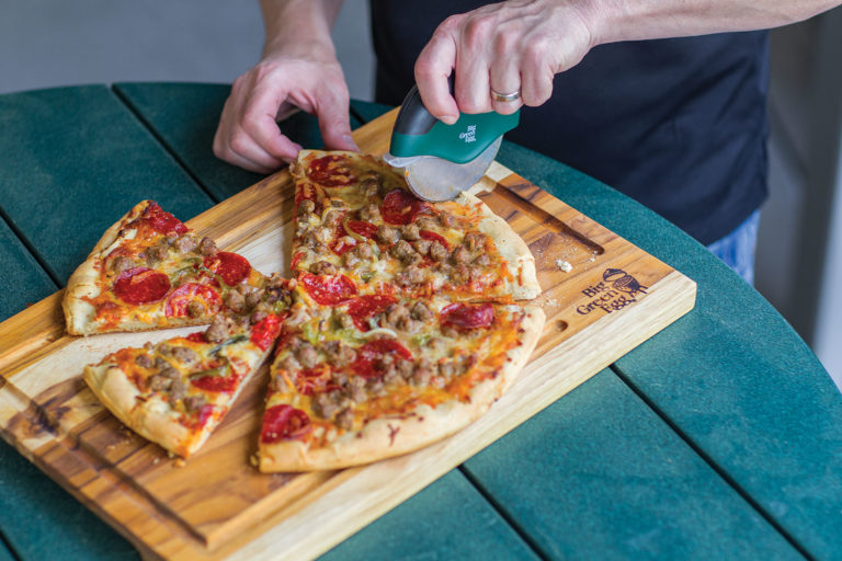 Cutting Pizza on Teak Board